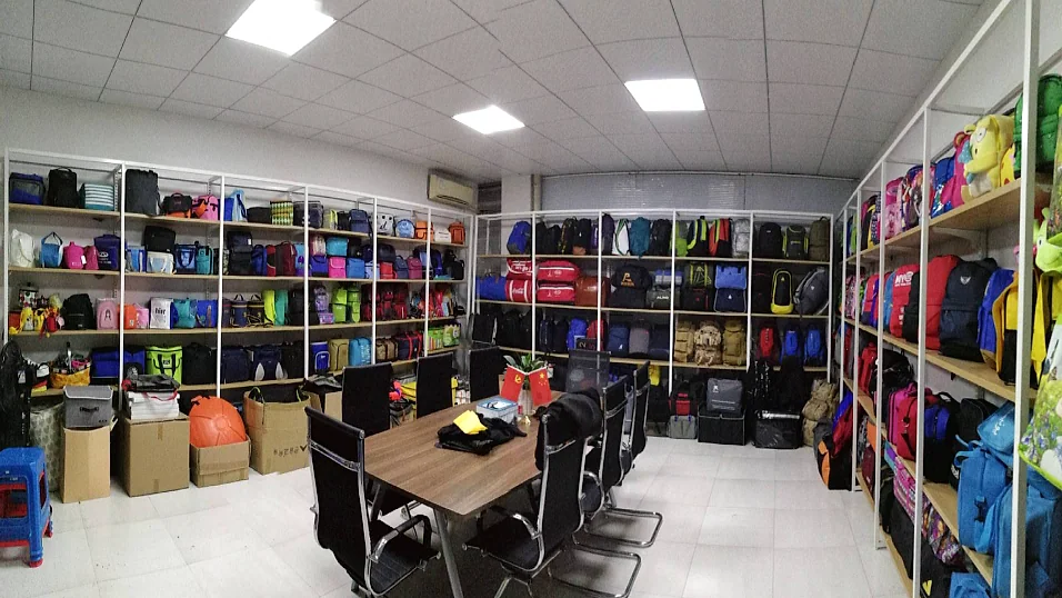 Bag sample room with product shelves and a meeting table