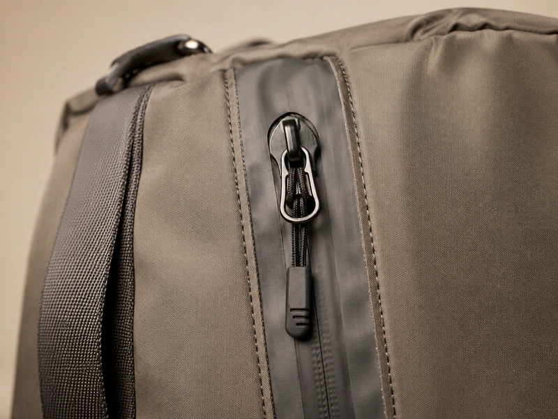Waterproof coated zipper detail on a functional bag